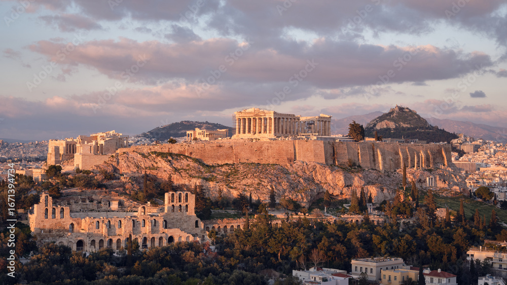 Fototapeta premium Ancient Acropolis of Athens with Parthenon temple at sunset, historic landmark and popular travel destination in Greece.