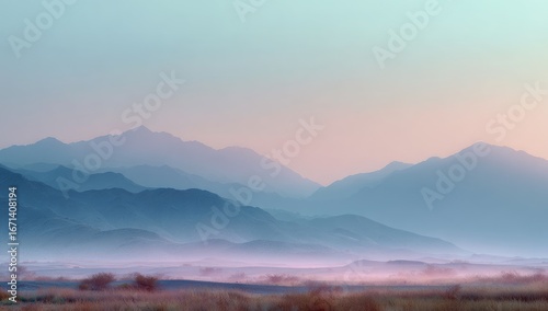 Misty mountain range at dawn