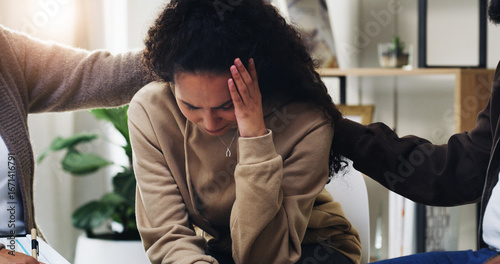 Photos Support group, people and sad woman in therapy for mental health and healing depression