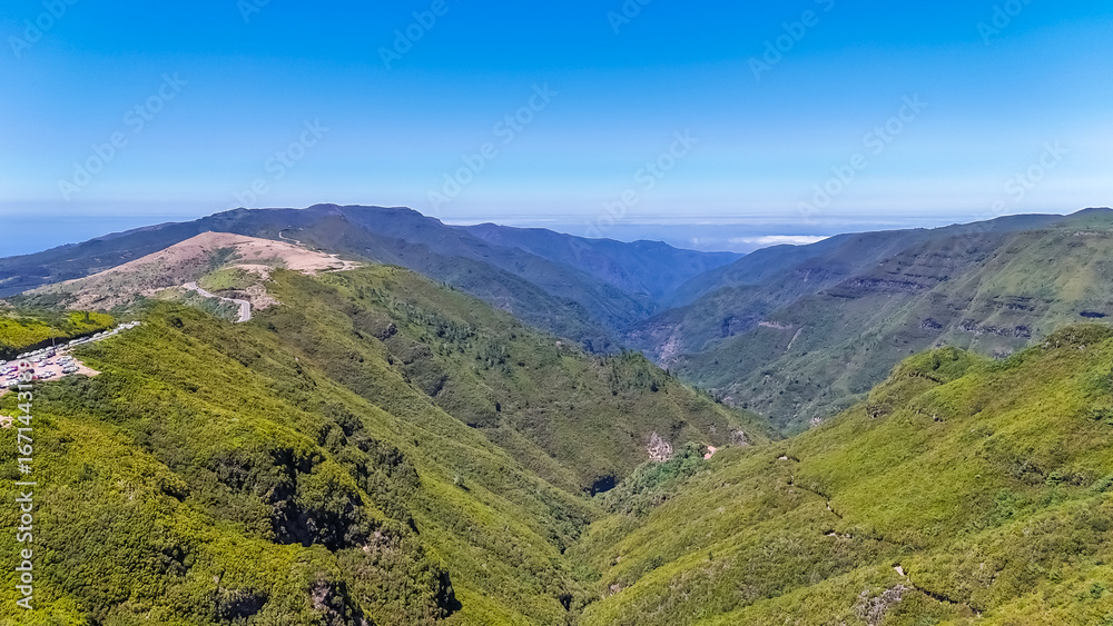 Naklejka premium Scenic view of green mountains and hills from the subtropical Laurissilva forest in Rabacal, Madeira Island, Portugal, Europe. Drone view. High quality photo