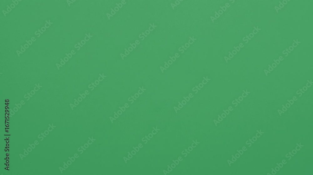 Stop motion animation of crumpled pape on a green background