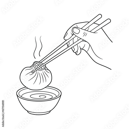 Hand holding hot steaming dumpling with chopsticks dipping into a bowl of sauce culinary concept