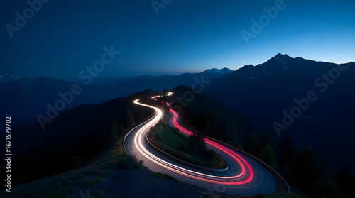 Winding mountain road at night with light trails and stars