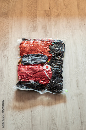 Clothing packed in vacuum compression travel bag