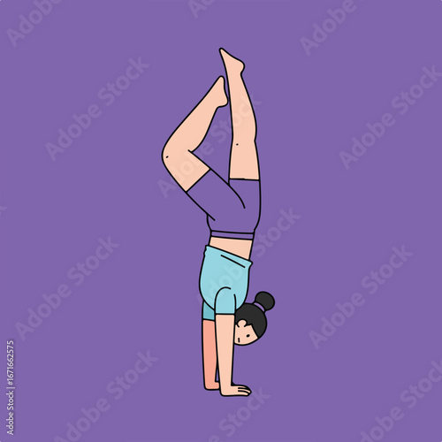 Woman doing a handstand pose on a yoga mat
