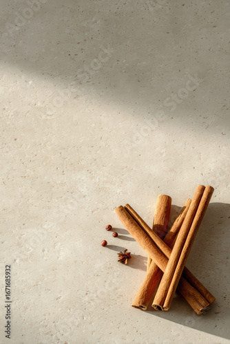 minimalist christmas celebration ambiance in usa featuring fragrant cinnamon stick on clean neutral background