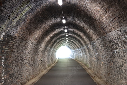 Photos View along a pedestrian and cycle tunnel on a disused railway line
