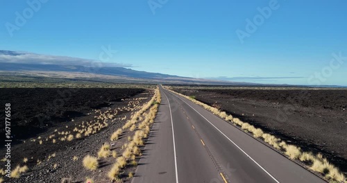 Aerial View of Empty Queen Ka'ahumanu Highway Through Volcanic Landscape in Hawaii
