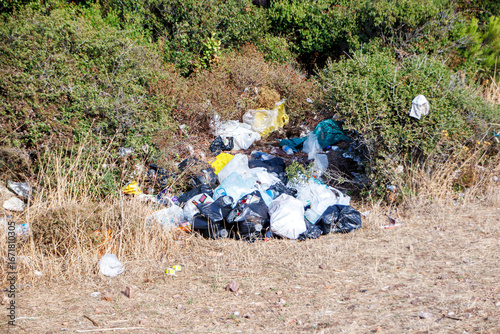 garbage left in the forest by trash-headed people