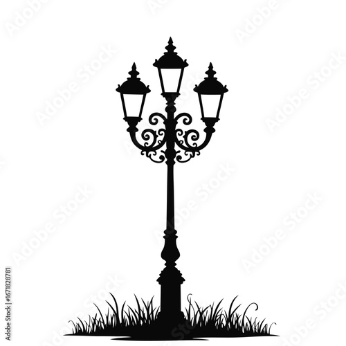 Black silhouette of a vintage triple lamp post with ornate scrollwork and grass