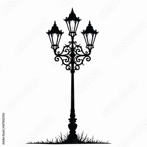 Ornate triple lamp post silhouette with grass street light
