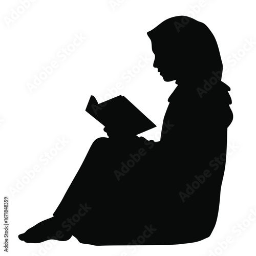 Silhouette of a person wearing a hijab reading a book 1