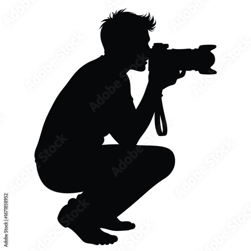 Silhouette of a man crouching with a camera photographer
