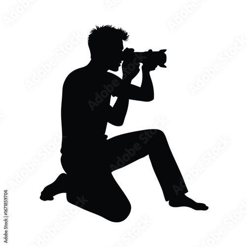 Silhouette of a man kneeling and taking a photo with a camera
