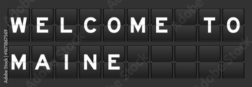 Black color analog flip board with word welcome to maine on gray background