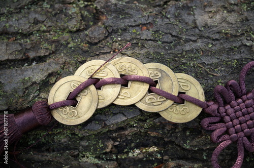 Wallpaper Mural A bunch of Chinese coins on a wooden background. Feng shui symbols. Torontodigital.ca