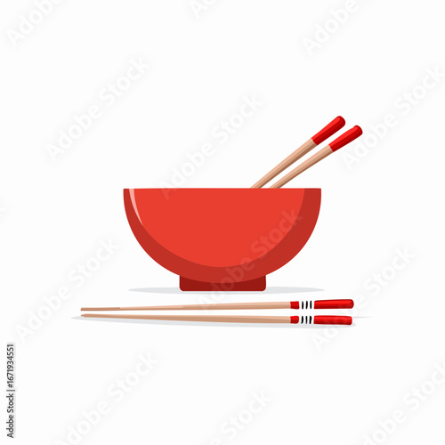 Red bowl with chopsticks resting inside and beside it for Asian cuisine