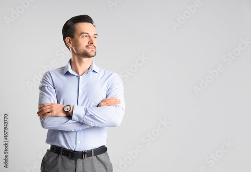 Handsome businessman on lig...