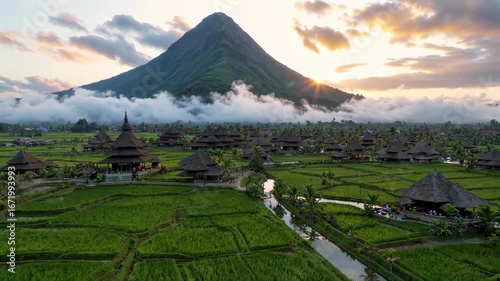 Wallpaper Mural Traditional architecture and distant mountain scenery beside rice fields Bali terraces Sunrise Torontodigital.ca