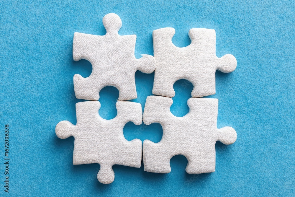 Obraz premium Connected Puzzle Pieces Together On Blue