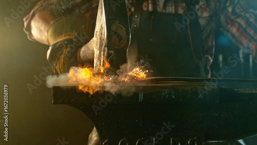 Quadro su tela The blacksmith manually forging the molten metal on the anvil in smithy with spa