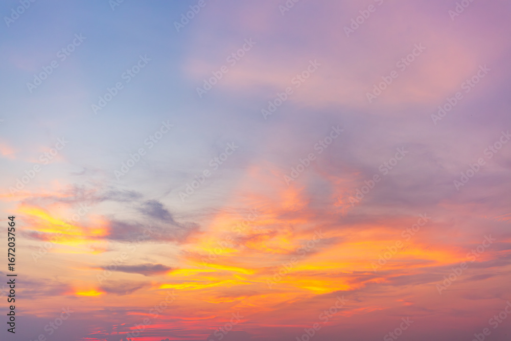 Obraz premium Morning cloud and sky background texture,colorful clouds and sky,Dusk, Sunset Sky Clouds in the Evening with colorful Orange, Yellow, Pink and red sunlight and Dramatic storm clouds on Twilight sky.