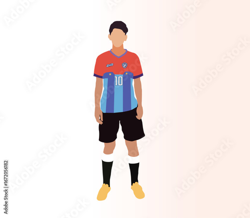 Young soccer player in red and blue uniform standing ready