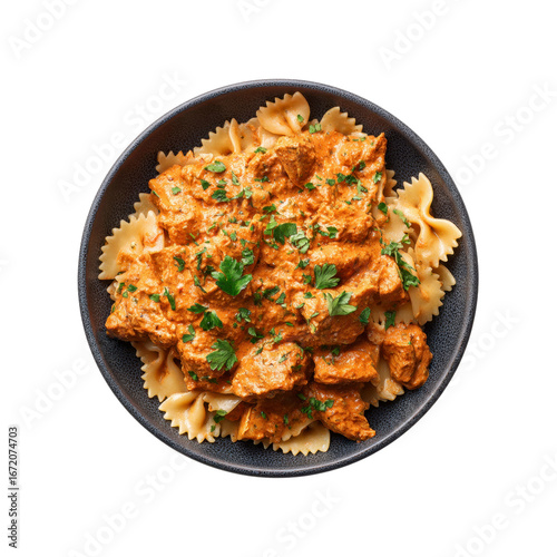 Delicious Creamy Tomato Chicken Pasta in a Dark Bowl - Overhead Shot