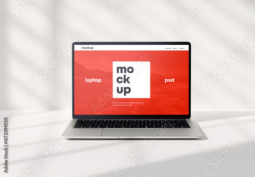 Laptop in clean white environment psd mockup