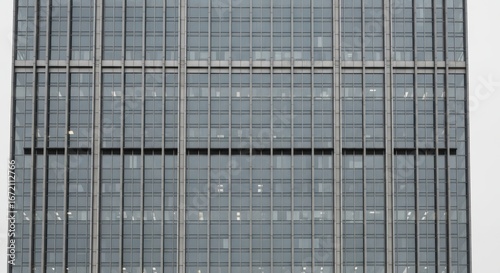 Wallpaper Mural Modern glass skyscraper exterior with rectangular windows in urban cityscape Torontodigital.ca