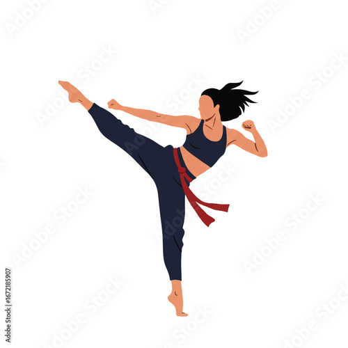 Focused woman practicing martial arts with a high kick in a studio, showcasing strength and discipline in a modern, minimalist style.