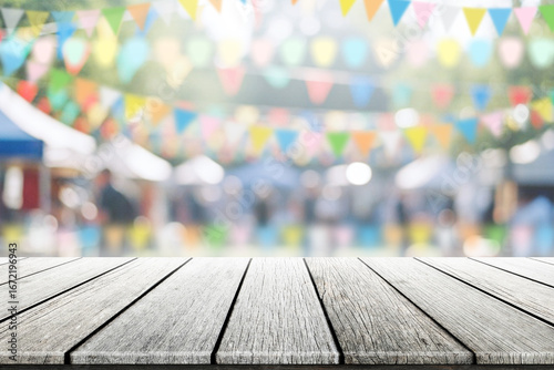 Empty wooden table with party in garden background blurred.