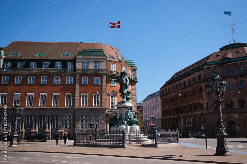 Naklejka premium Historic Architecture and Statue in Copenhagen, Denmark - May 6, 2023