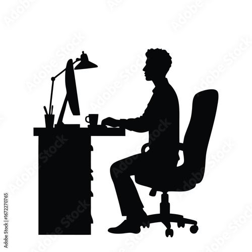 Man silhouette working at desk with computer and lamp