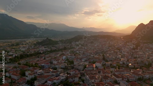 Aerial Drone Shot Of Kalabaka Town And Meteora Mountains In Greek Macedonia, Greece At Sunset.