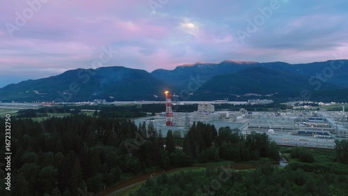 A large natural gas processing facility set against the mountains in Kitimat, British Columbia