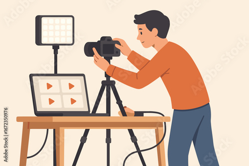 Young man setting up a camera and lighting equipment for video recording in a home studio