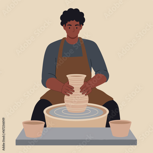 Man Shaping Clay Pot on Pottery Wheel in Workshop (1)