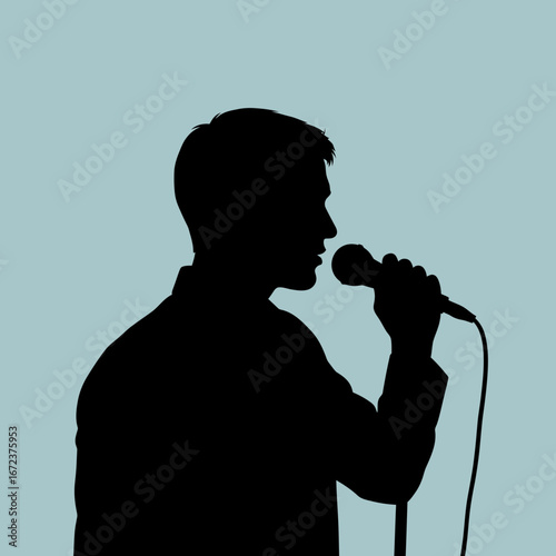 Silhouette of a person singing into a microphone against a blue background.