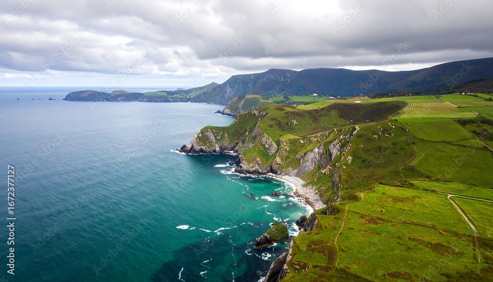 Fototapeta premium Coastal landscape, dramatic cliffs, and lush green hills