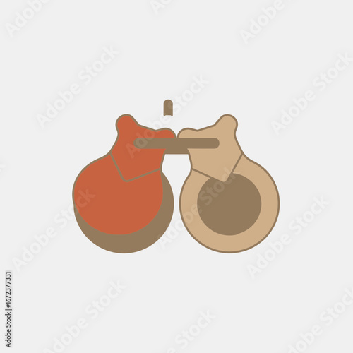 Two wooden castanets on a light gray background.