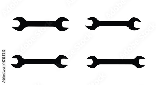 Four black adjustable wrenches on a white background