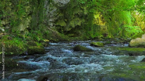 A 20-second still video of the Aude River in the Axat Valley. Water flows among rocks with small waterfalls in the forests of southern France.
