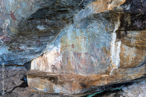 Ancient rock art at Kondoa, Tanzania, depicting human figures painted on stone, part of the UNESCO World Heritage archaeological site.