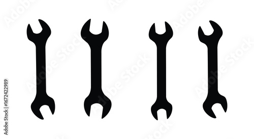 Four black wrenches on a white background
