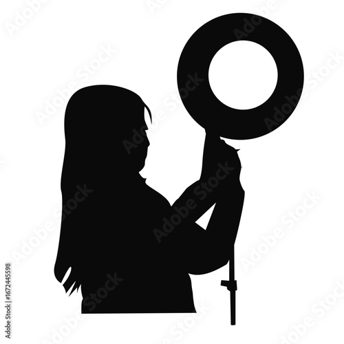 Silhouette of an influencer standing with a ring light, representing social media content creation, live streaming, vlogging, and digital influence. Minimal and modern vector concept for creative 