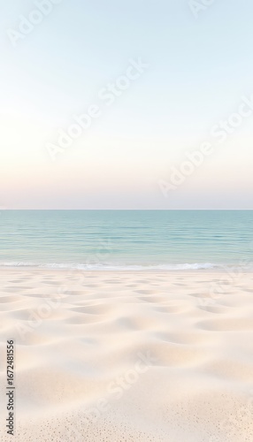 Calming waves gently washing the pristine sand under a soft blue and pale yellow sky.