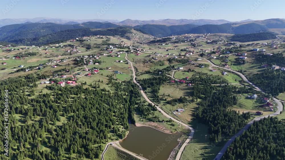 Scenic Drone Shot of Highland Plateau with Lake and Pine Forest in Turkey