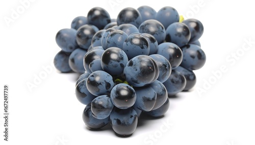 Beautiful bunch of fresh concord grapes on a bright white backdrop
