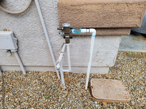 Branching pipes connecting house water supply and drop irrigation system